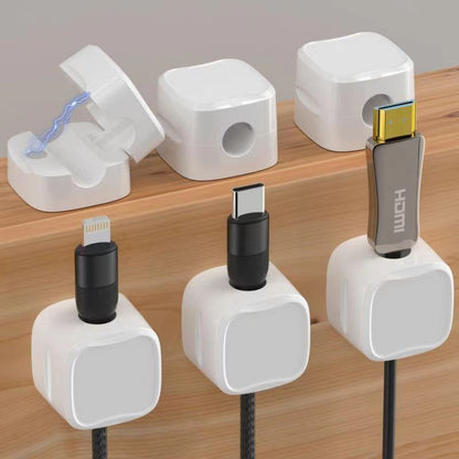 White magnetic cable holder cord clips for organizing cords on a desk, simple magnetic closing for efficient cable management by Grizzly Supply. 